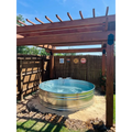 A round galvanized steel stock tank pool with fountain installed by stock tank pools WA in perth 