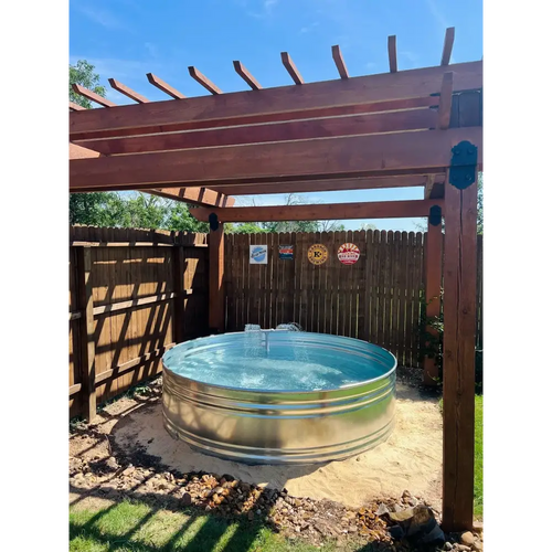 A round galvanized steel stock tank pool with fountain installed by stock tank pools WA in perth 