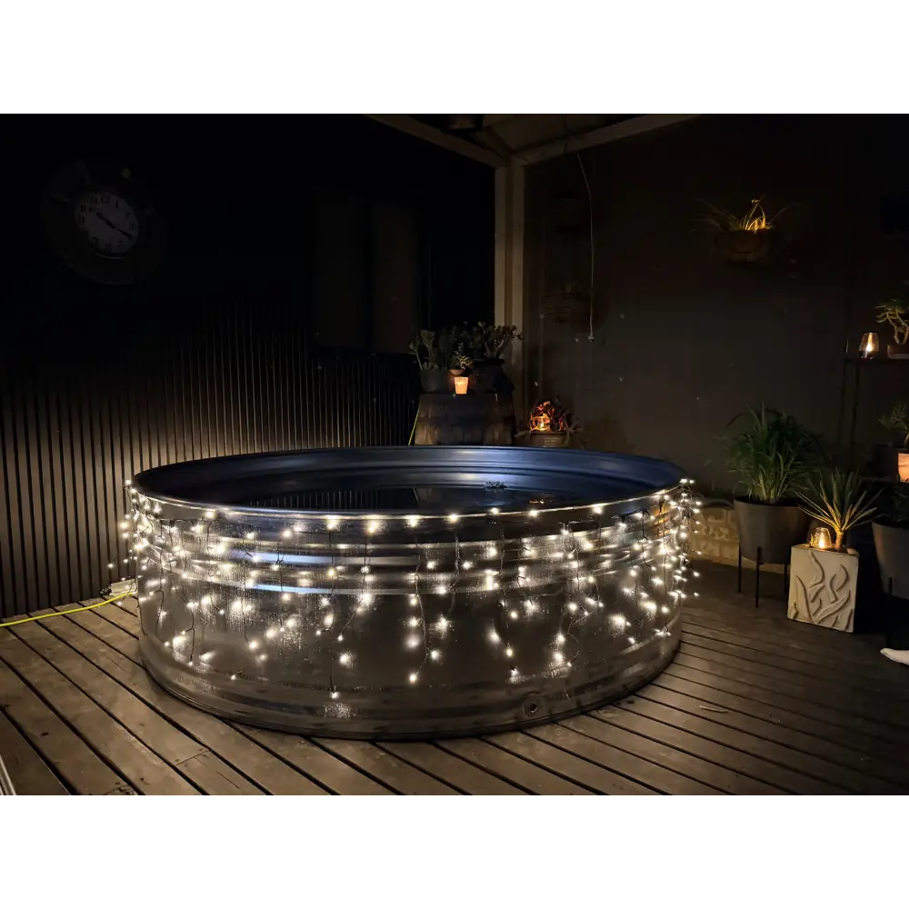 night time stock tank pool on decking in australia, patio design for small stock tank pool